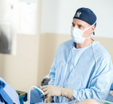 Dr. White in full PPE in the operating room.